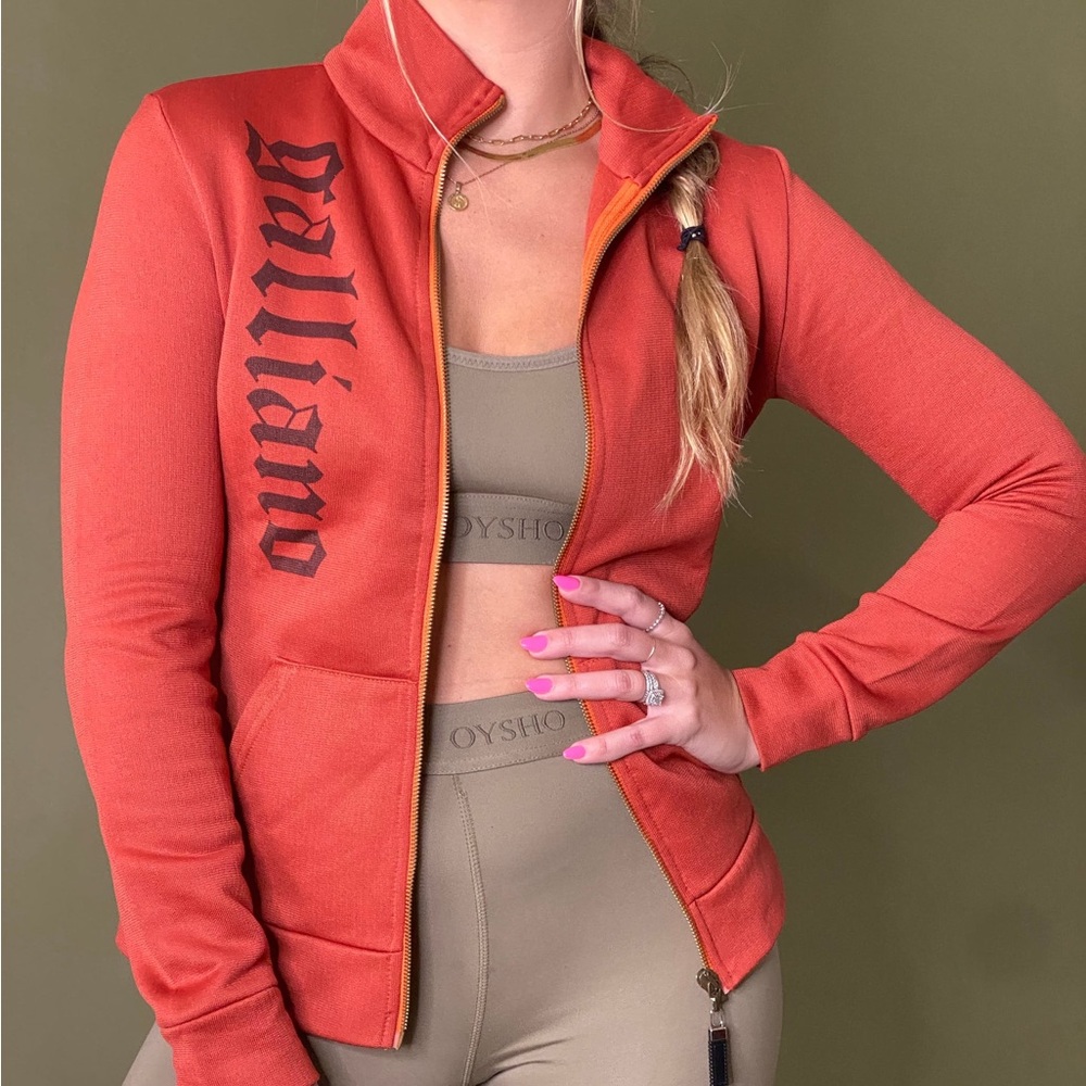 John Galliano orange track jacket.

Condition: Excellent.